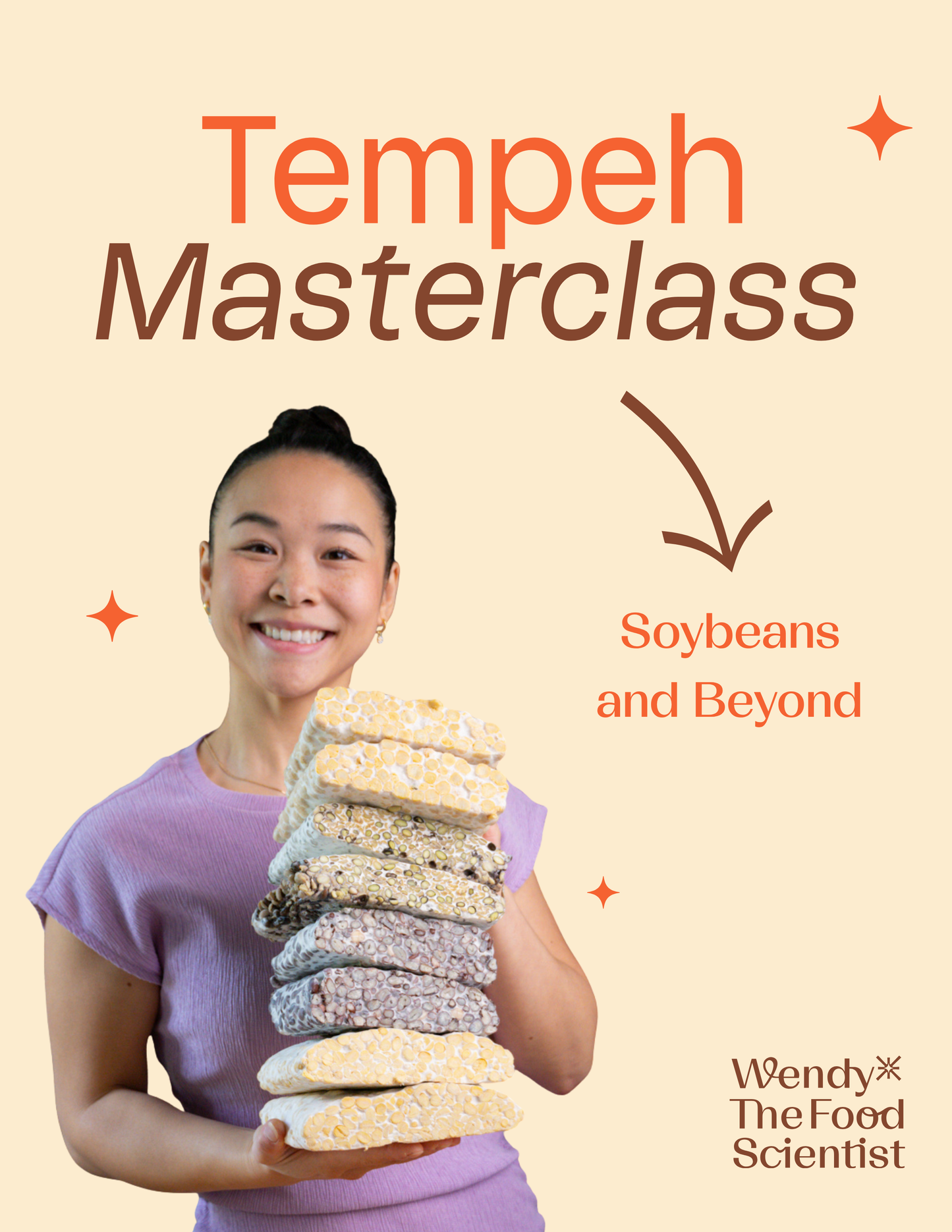 Tempeh Masterclass, Soybeans and Beyond. Wendy holding a stack of tempeh cakes made from different beans and grains.